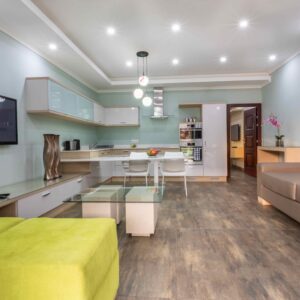 The living room and open kitchen of a guest suite at Fallsway Suites, Lusaka
