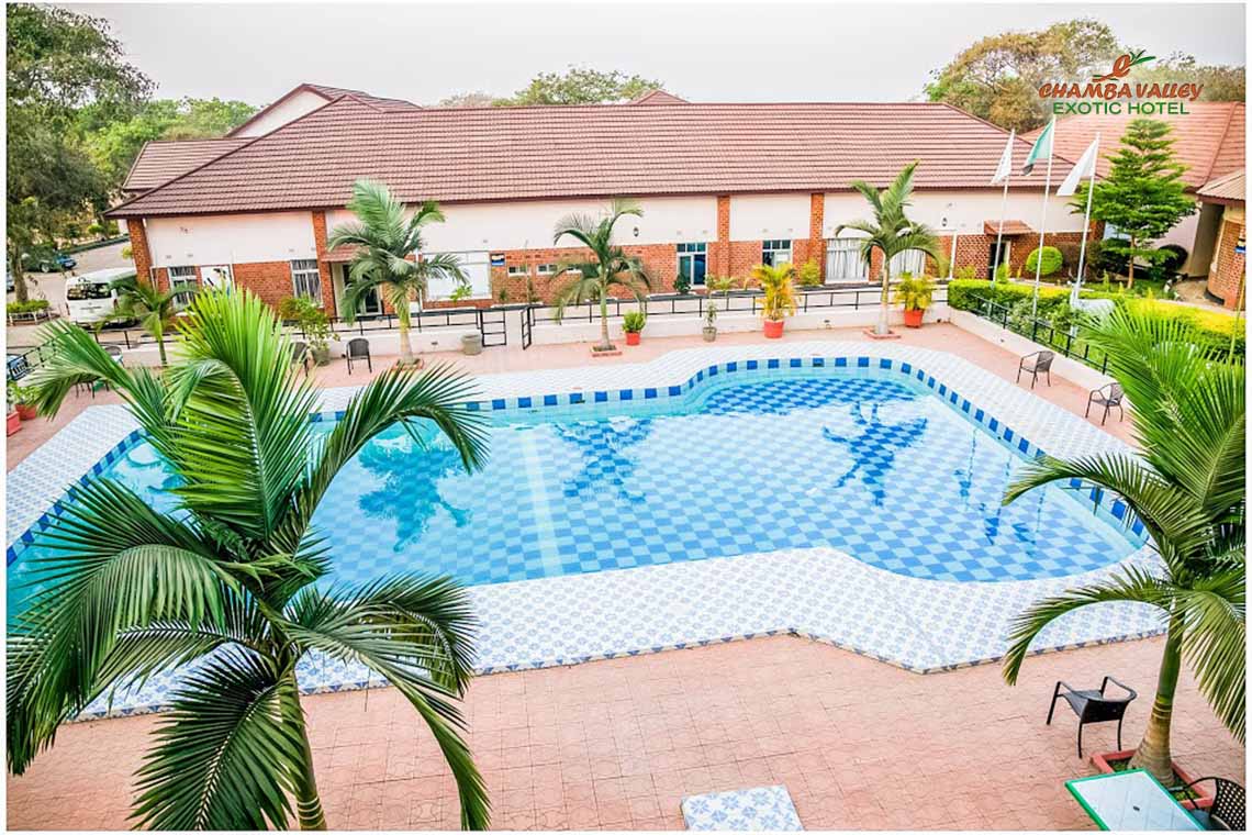 The swimming pool and terrace with the main building behind at Chamba Valley Exotic Hotel, Lusaka