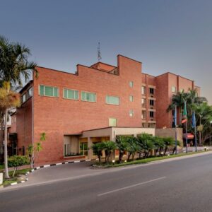 The red-brick street frontage of Protea Hotel by Marriott Lusaka at the Arcades complex, at dusk