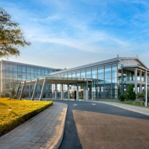 The glass-fronted entrance and porte-cochere of Protea Hotel by Marriott Lusaka International Airport