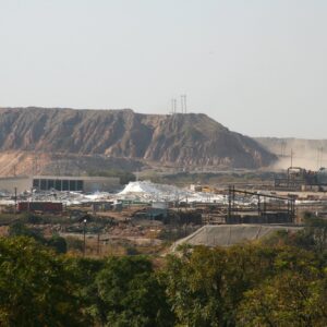 Terraced benches of the Nchanga open-pit copper mine near Chingola on the Zambian Copperbelt. Context photograph of the town around Protea Chingola, not of the property itself.