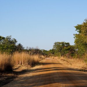 The road south from the Kafue National Park entrance, Zambia. Context photograph of the country around Mayukuyuku Bush Camp, not of the property itself.